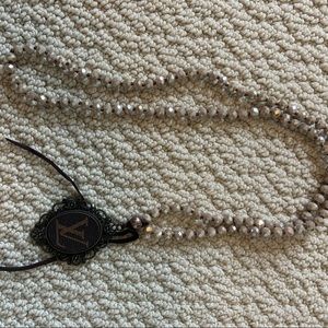 Repurposed Louis Vuitton necklace.